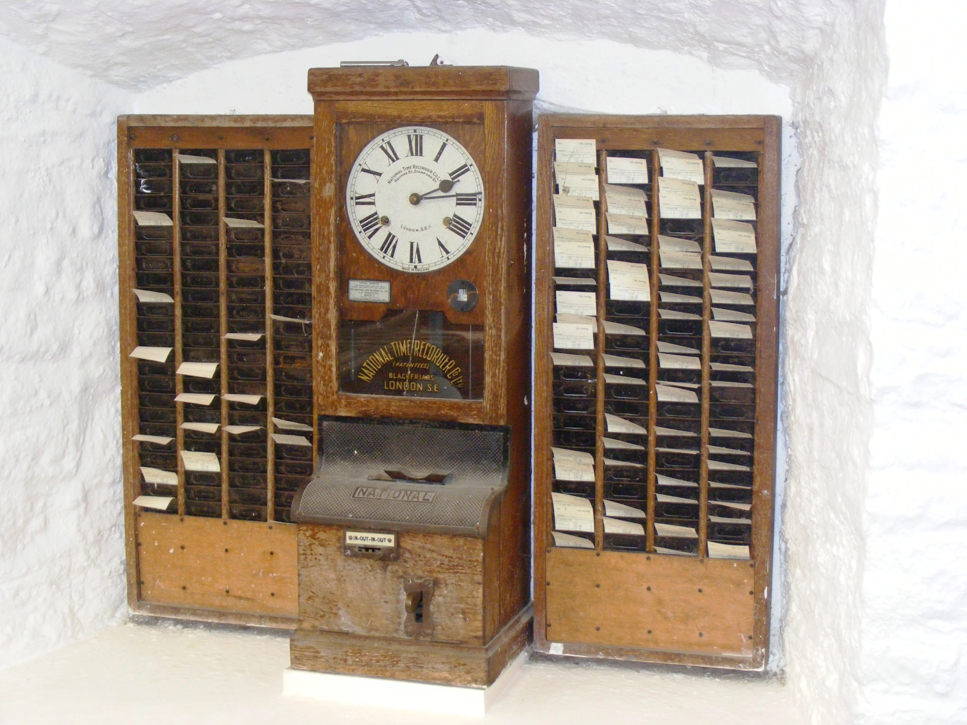 Early time clock, made by National Time Recorder Co. Ltd. of Blackfriars, London at Wookey Hole Caves museum