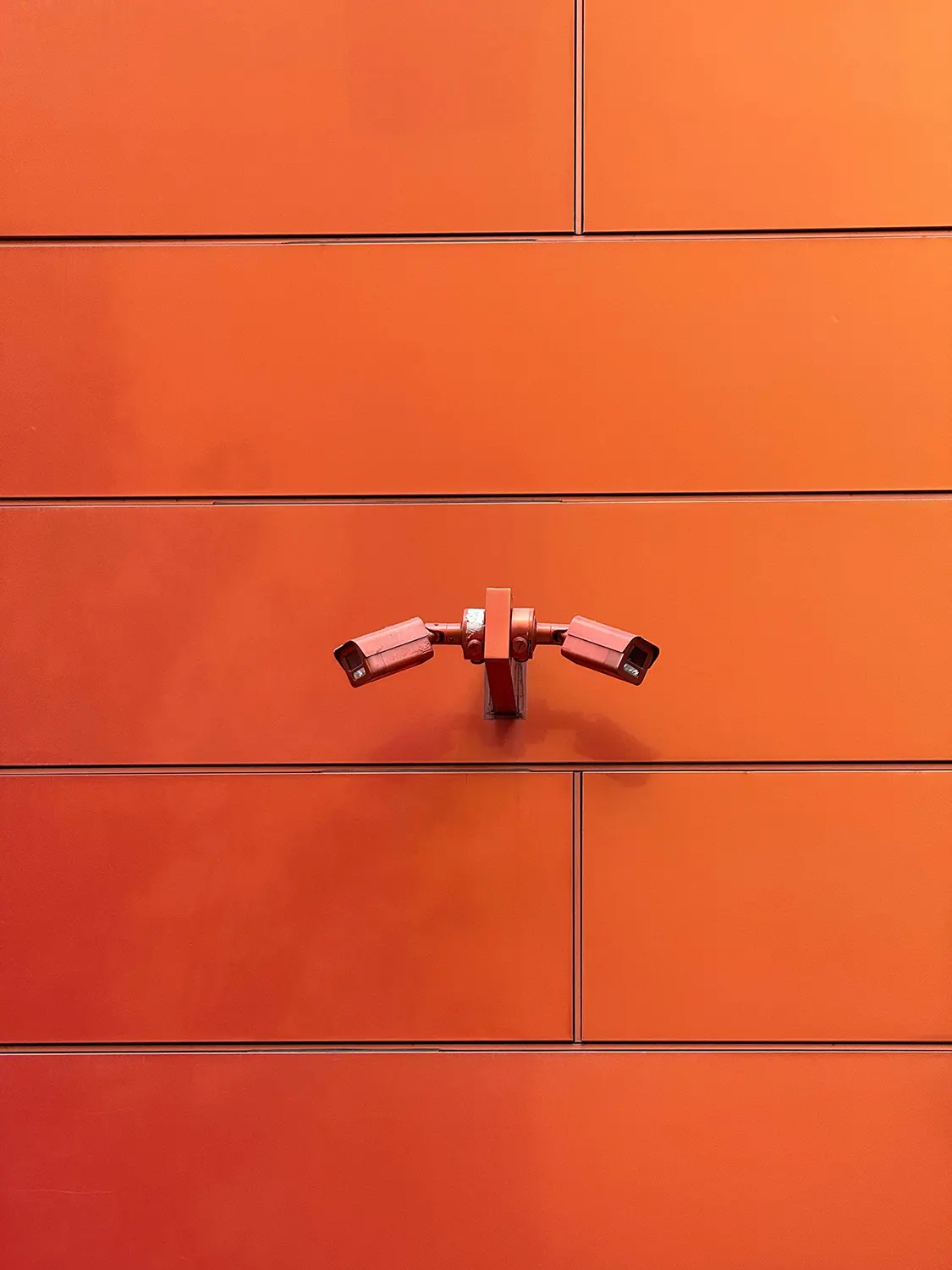 Cameras mounted on a wall. 